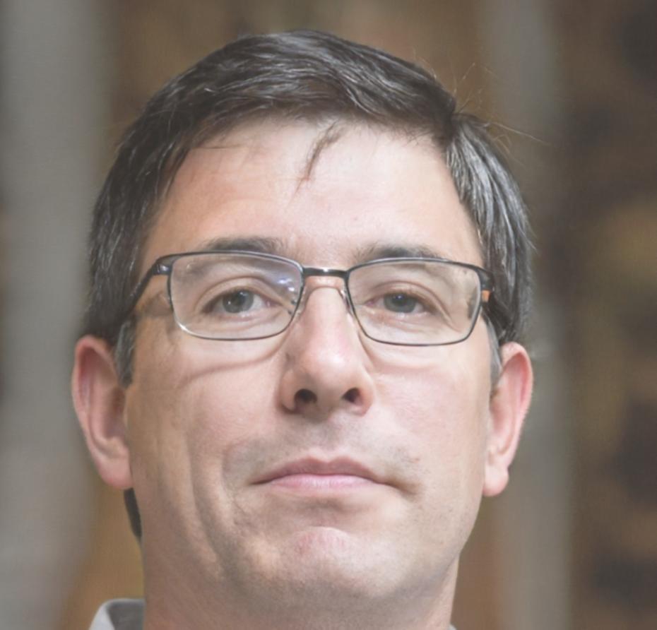 Professional headshot of satisfied business acquisition client